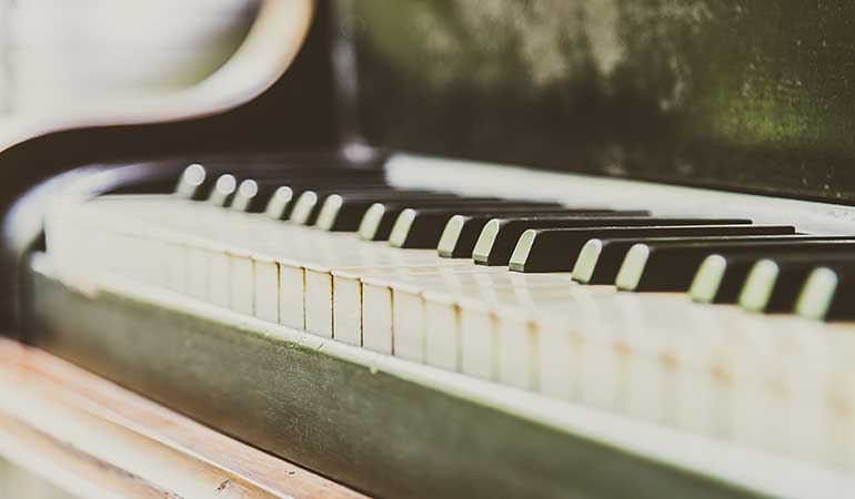Close up view of keys on a vintage piano