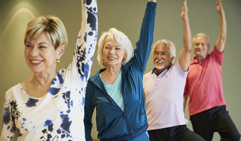 Residents participating in a yoga class