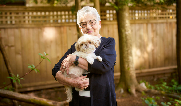 cedar Springs PARC resident Cathy holding her dog Daisy Mae