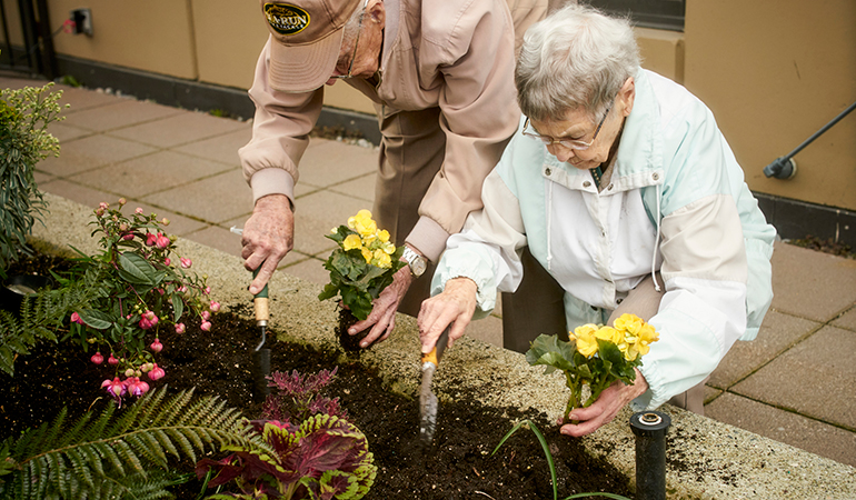 Mulberry PARC residents Bob and Virginia planting flowers