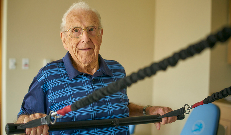 Mulberry PARC resident Bob working out in the gym