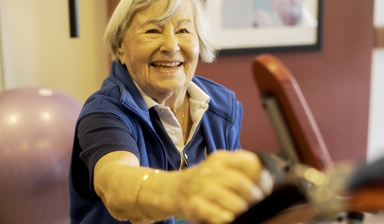 Summerhill PARC Resident Gerta working out in gym