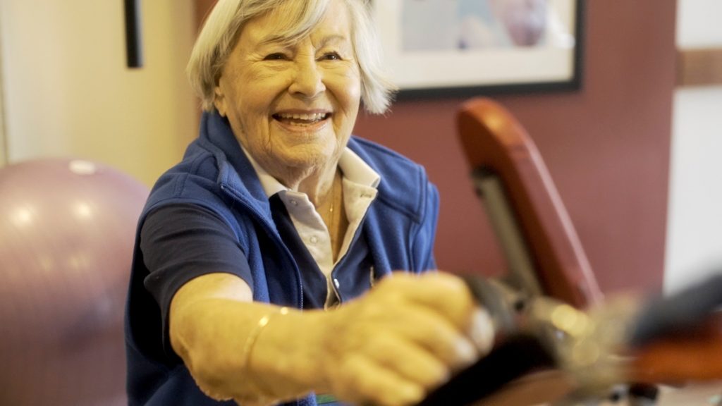 Resident Gerda exercising in the PARC gym