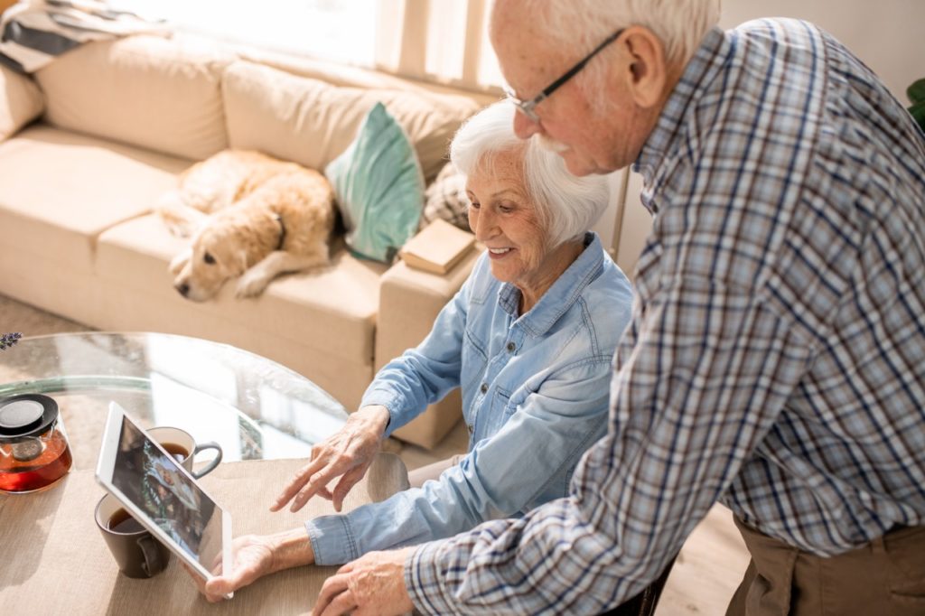 Senior couple taking online classes